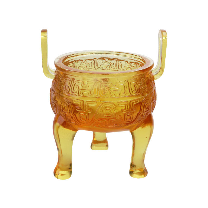 Adornos de trípode de esmalte de color dorado.