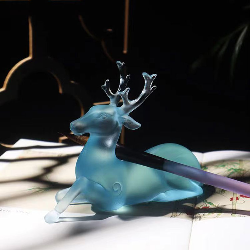 Portaescobillas de cristal azul con forma de ciervo